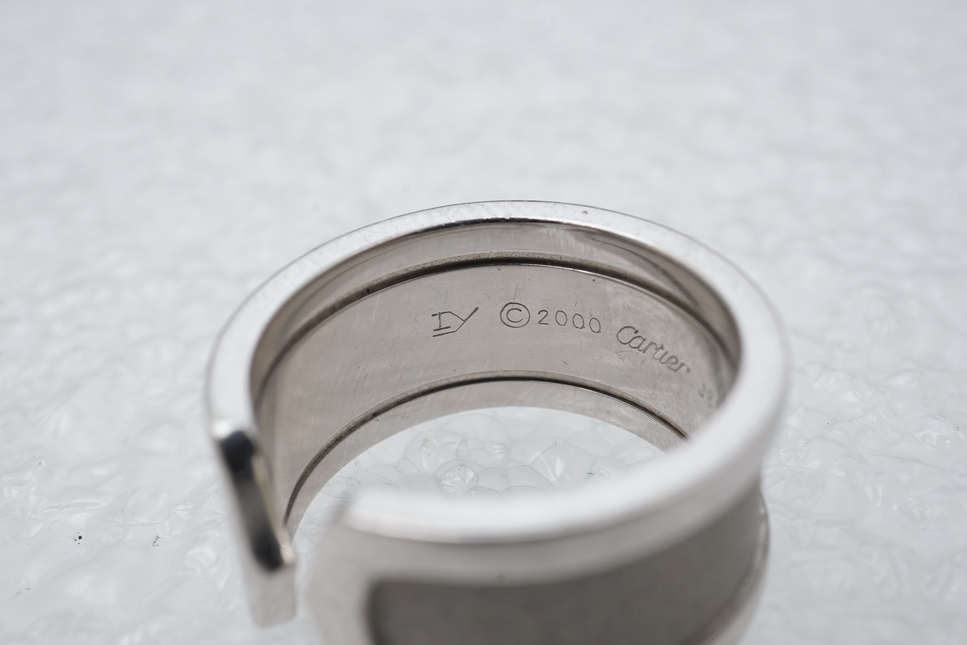 Cartier, a white gold ring, 'C de Cartier', circa 2000